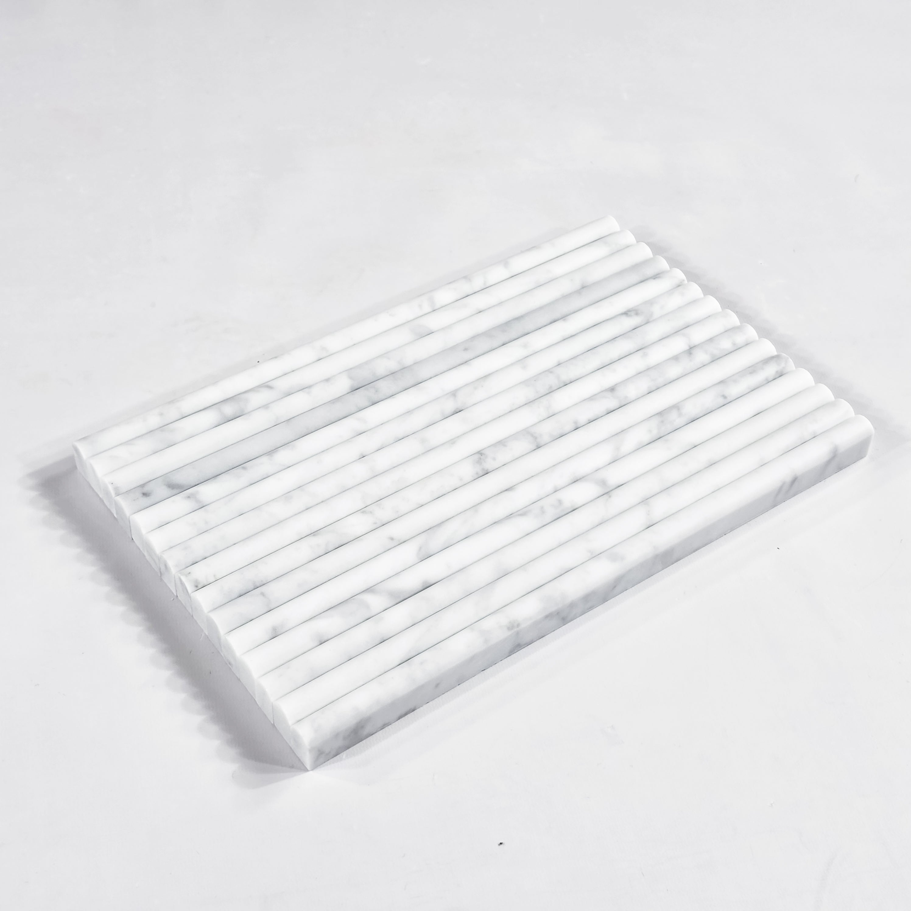 Elon Tile Petite Pencil tile arrangement — available at Surface Group