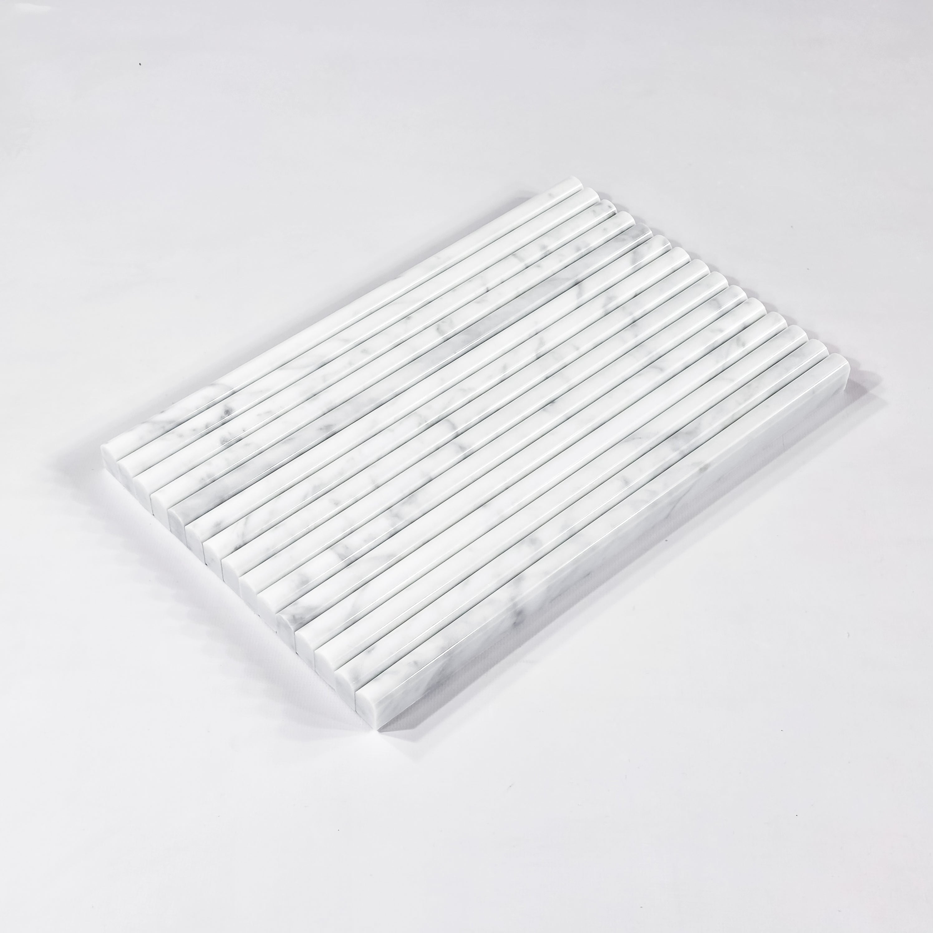 Elon Tile Petite Pencil tile arrangement — available at Surface Group