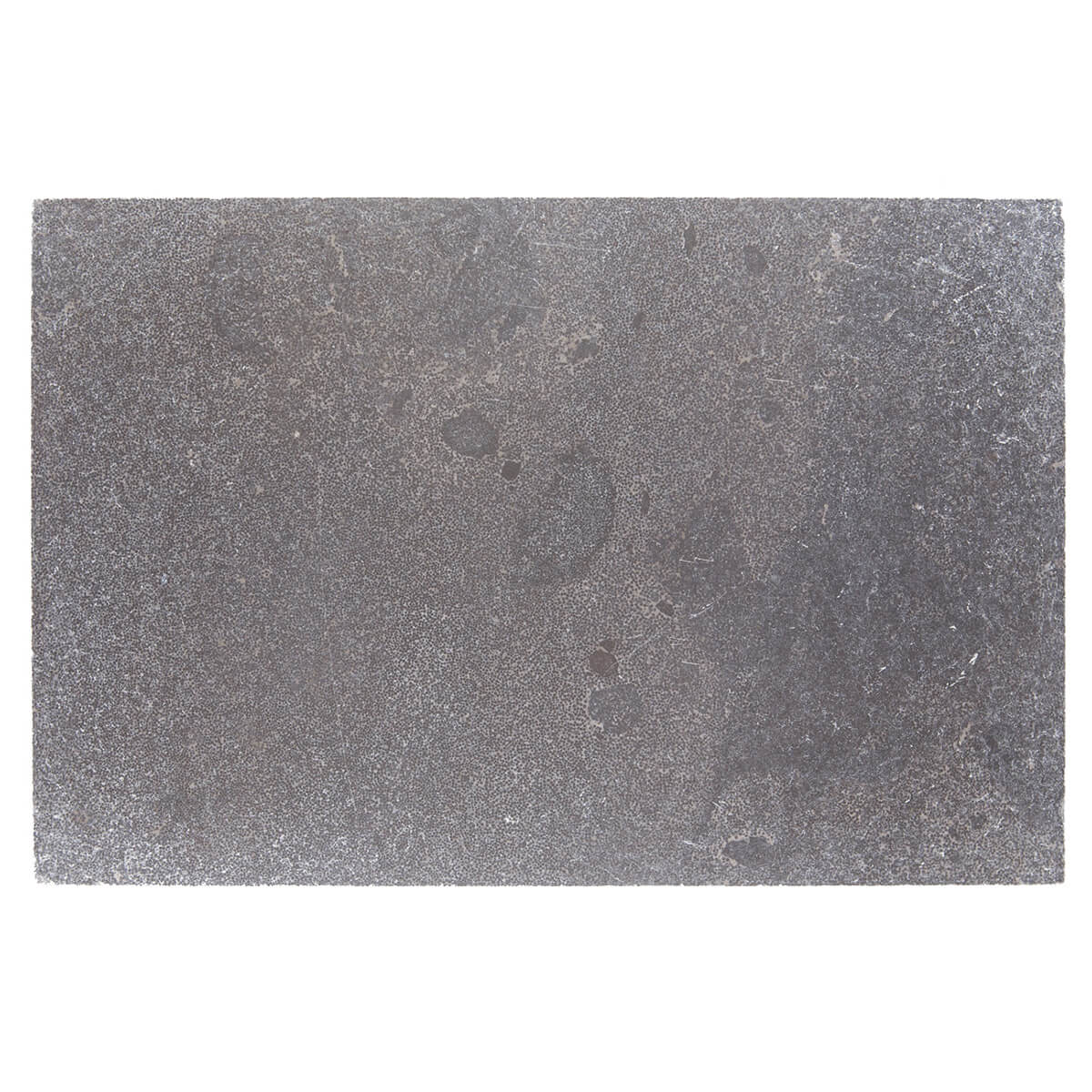 Pierre Noire limestone field tile from Haussmann, tumbled and worn finish, 16"x24"x5/8" size, suitable for residential and commercial flooring, wall cladding, and dimensional carving.