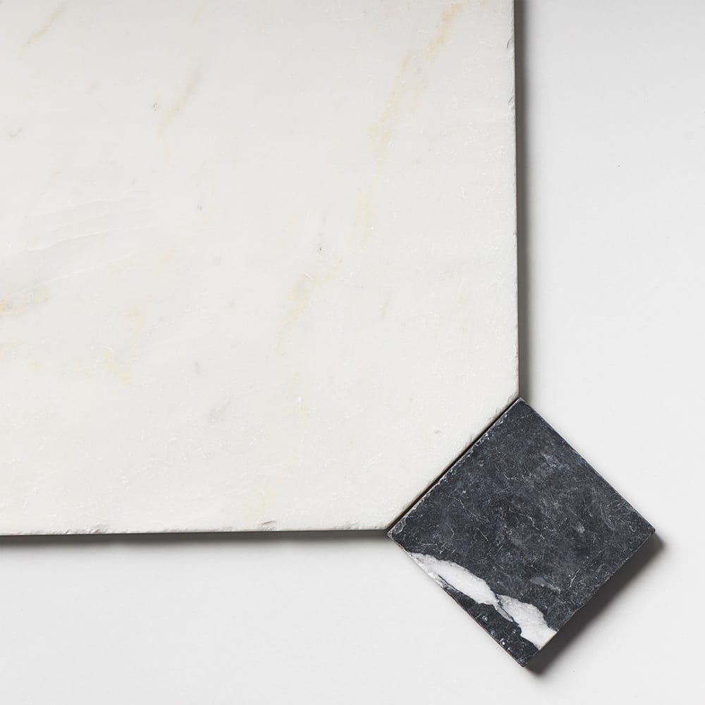 Marble Systems Calacatta Amber Marble Black Calacatta Amber rugged marble tile pattern swatch — available at Surface Group