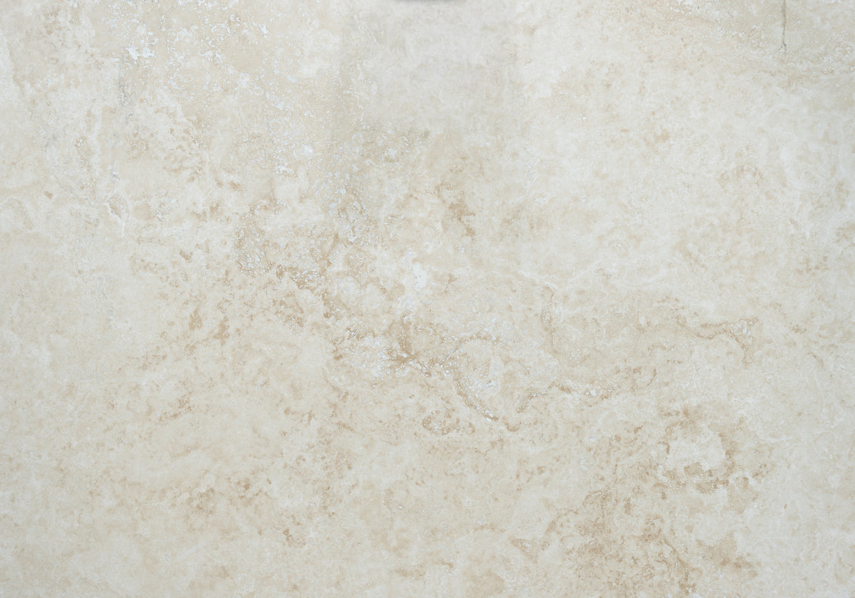 Marble Systems Ivory Travertine Ivory matte travertine tile — available at Surface Group