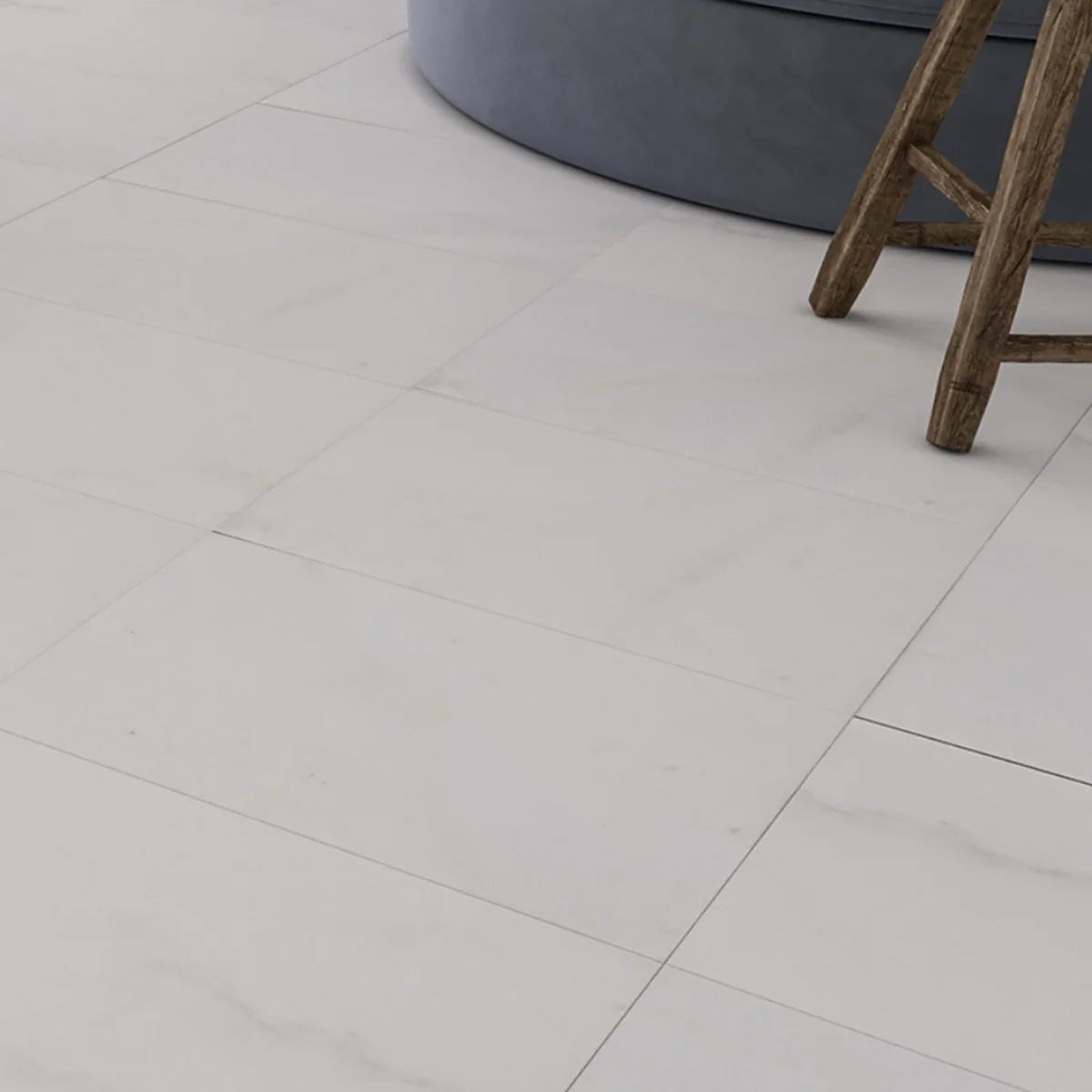 Essentials Natural Stone White field tile, lifestyle installation view. Premium marble for floors and walls.