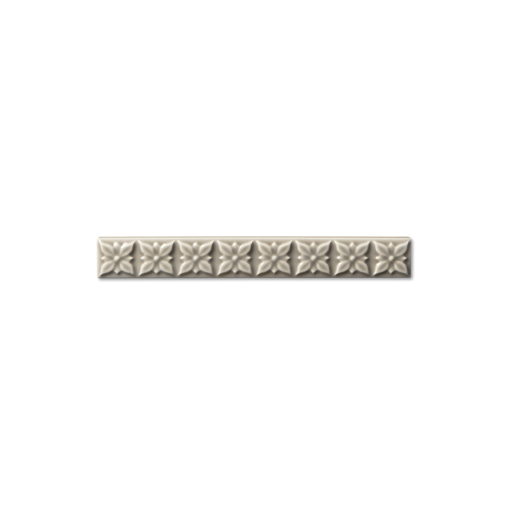 adex ceramic tile for indoor wall and or floor studio graystone molding deco liner deco glossy translucent mono embossed deco 1x7_8 embossed ponciana distributed by surface group international