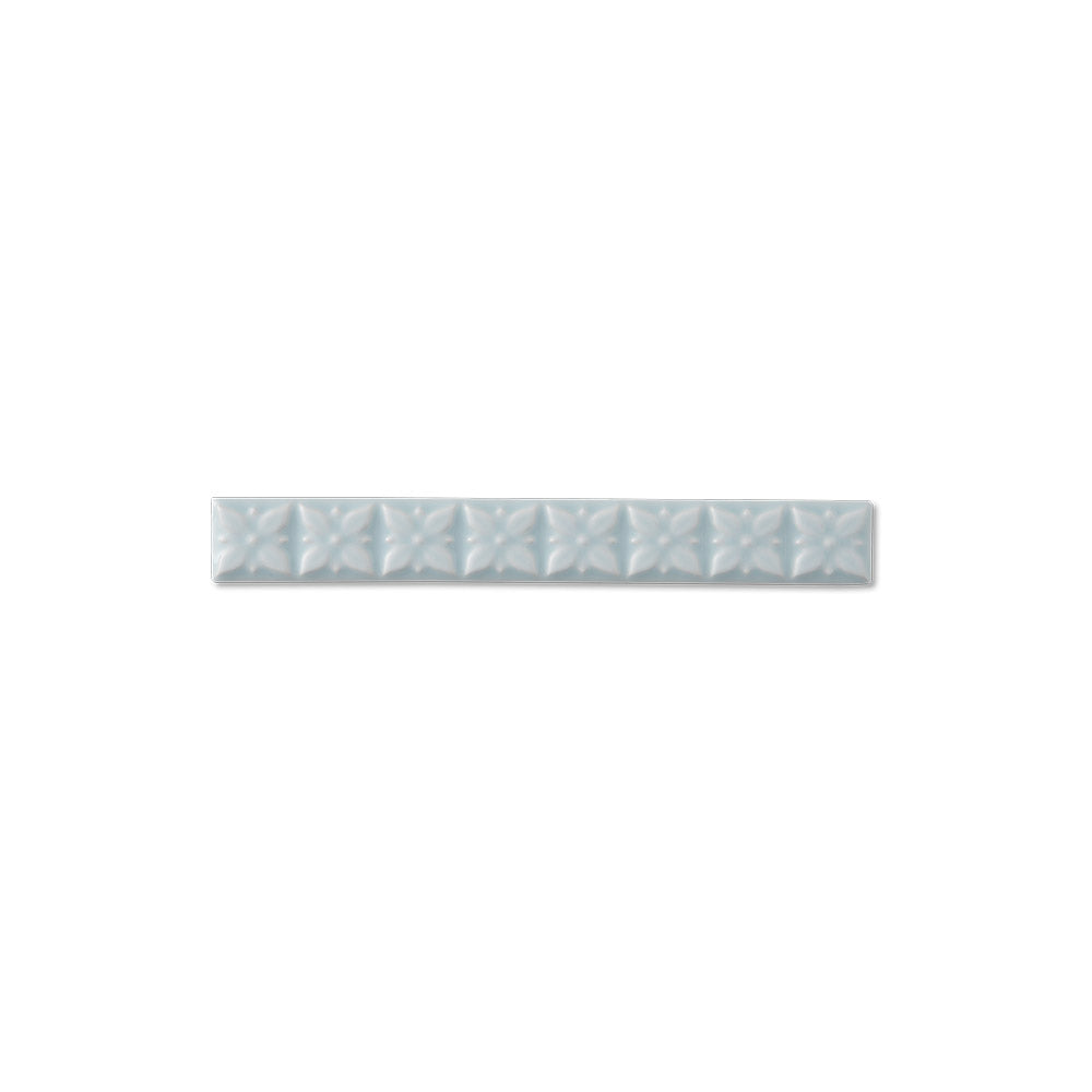 adex ceramic tile for indoor wall and or floor studio ice blue molding deco liner deco glossy translucent mono embossed deco 1x7_8 embossed ponciana distributed by surface group international