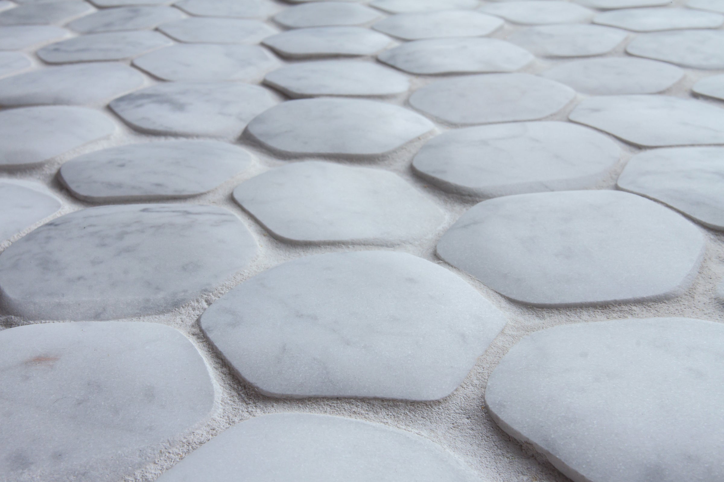 giovanni barbieri timeworn carrara natural white marble hexagon pattern mosaic distributed by surface group international