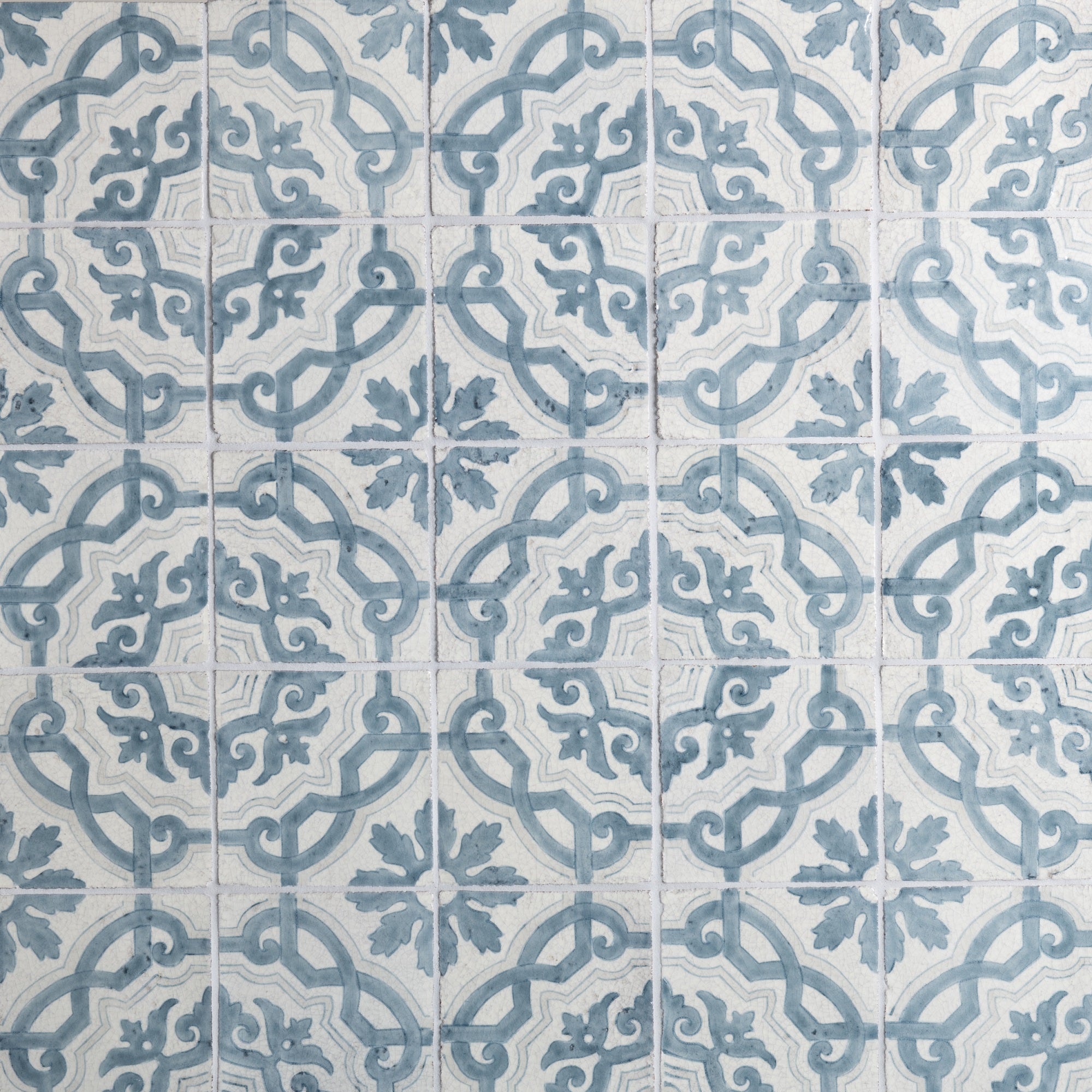 Hand-painted ceramic tiles from the Majolica collection, showcasing vibrant Mediterranean patterns and colors.