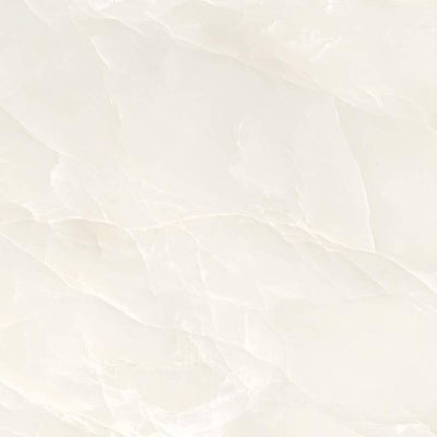 A close-up image of a porcelain tile with an ivory color and subtle marbling effect, featuring delicate veins in a soft beige to golden hue that emulate the look of natural onyx stone.