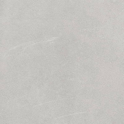 Close-up view of a porcelain tile with a subtle texture and variations in shades of light grey, mimicking the look of natural stone or concrete.