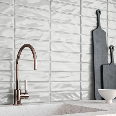 Modern kitchen backsplash featuring Anatolia Marlow Glazed Ceramic Tiles in a glossy finish, with reflective surfaces adding depth and elegance to the space.