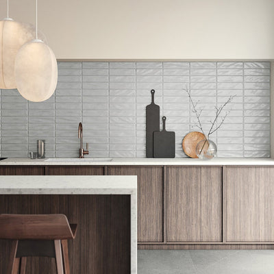 Modern kitchen backsplash featuring Anatolia Marlow Glazed Ceramic Tiles in a glossy finish, with reflective surfaces adding depth and elegance to the space.