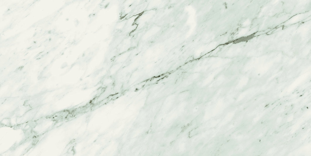 Elegant matte porcelain tile with soft Carrara marble veins in refined white, perfect for timeless luxury interiors.