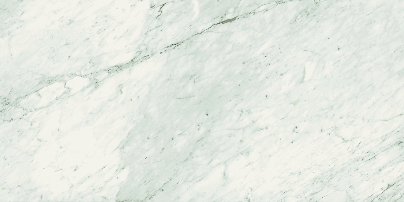 Elegant matte porcelain tile with soft Carrara marble veins in refined white, offering timeless luxury for sophisticated interiors.