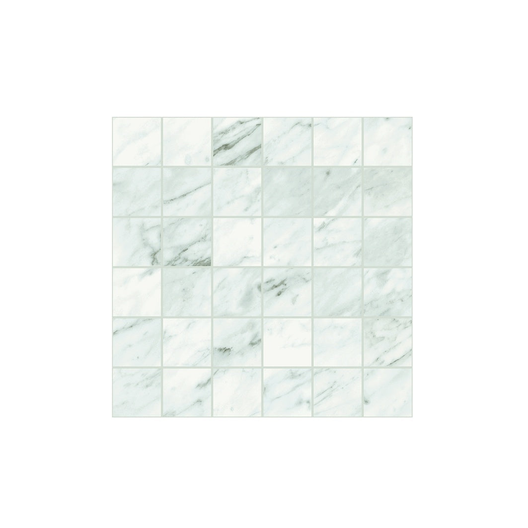 Elegant Carrara marble-look porcelain mosaic with soft gray veins in a refined matte finish for timeless luxury interiors.