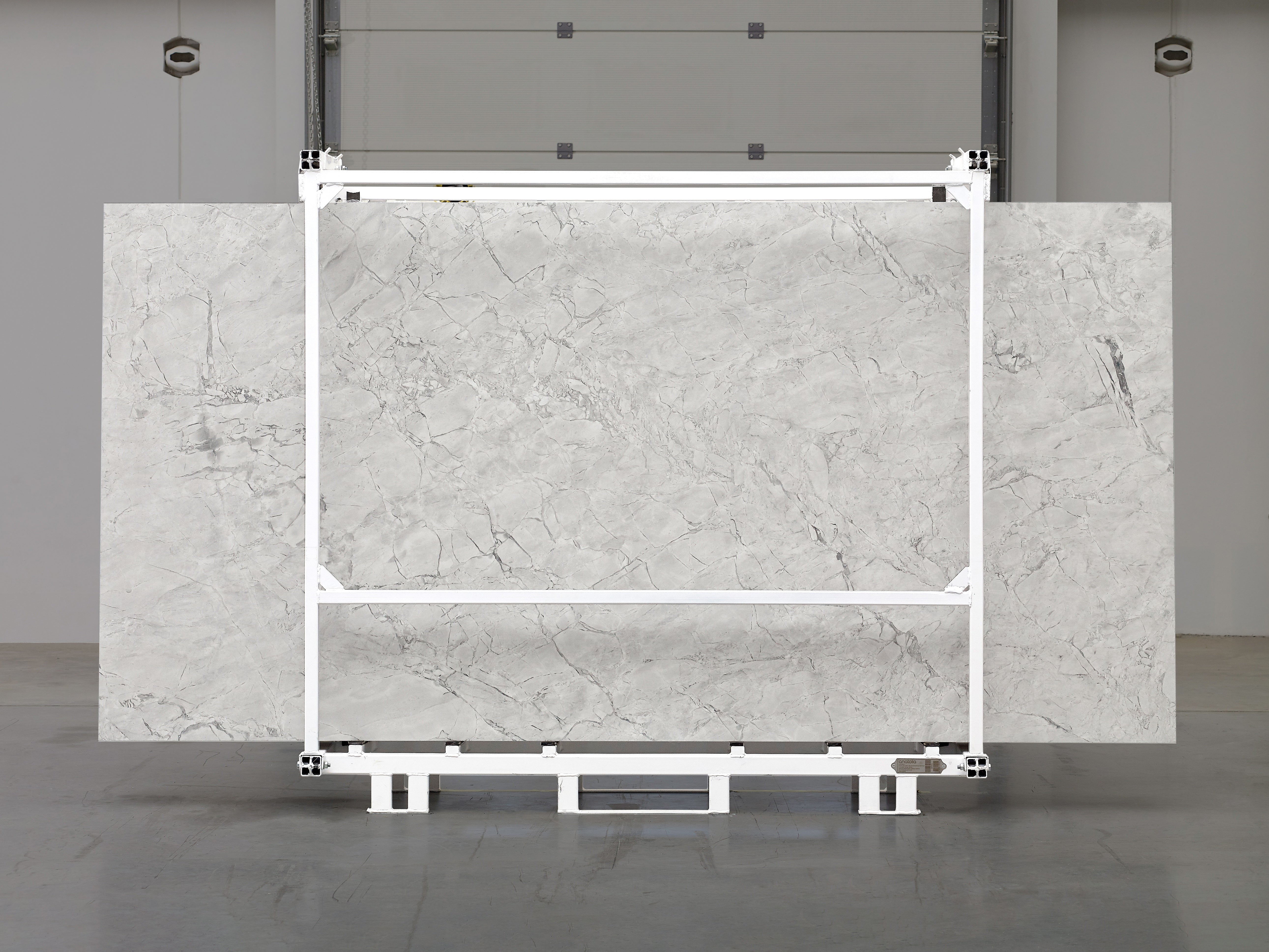 Majesto Super White sintered stone slabs by Anatolia, top-down product view, 64"×127"×15/32" size. Turkish sintered stone for floors and walls.