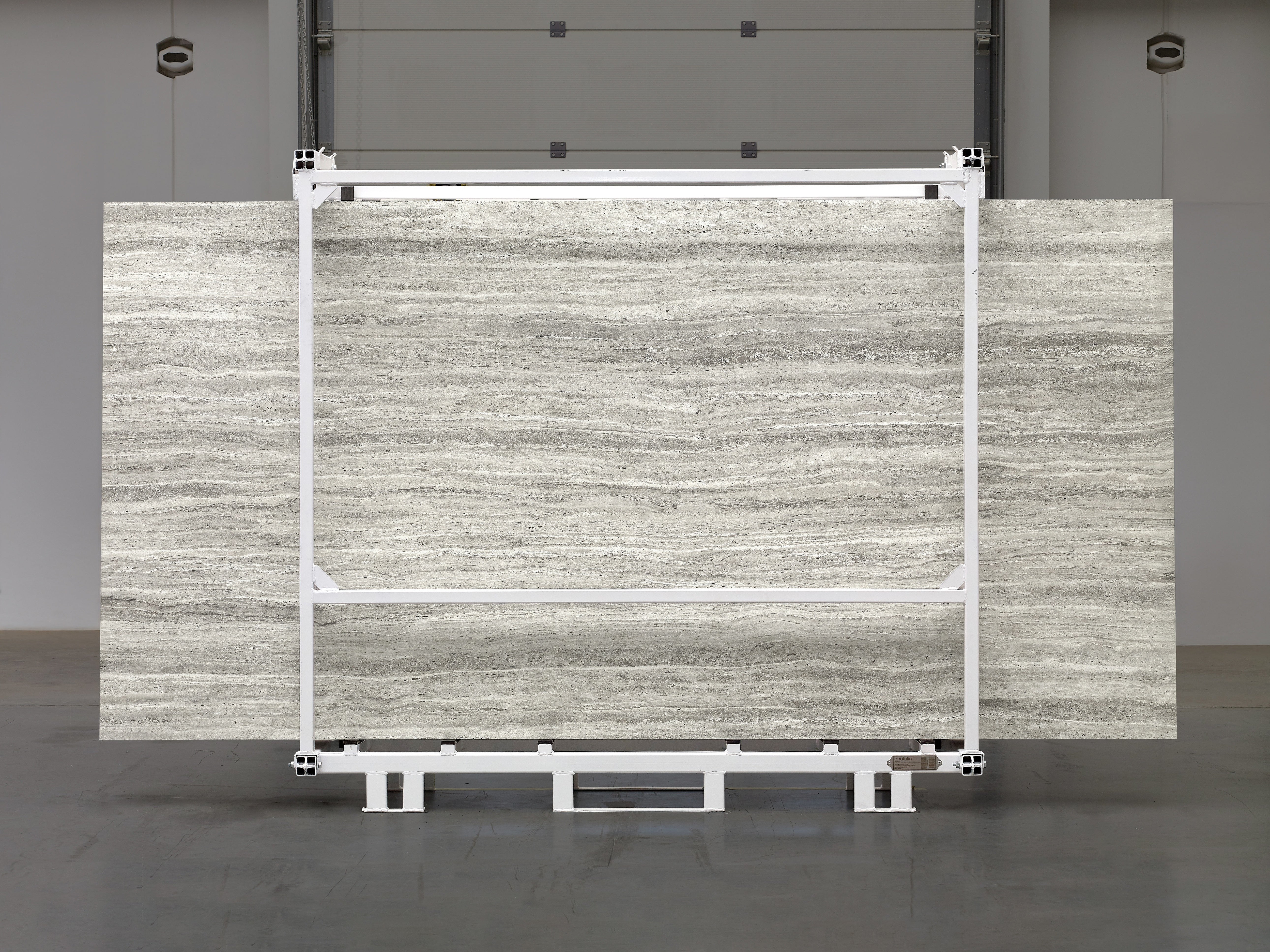 Majesto Travertino Titanium sintered stone slabs by Anatolia, top-down product view, 64"×127"×15/32" size. Turkish sintered stone for floors and walls.