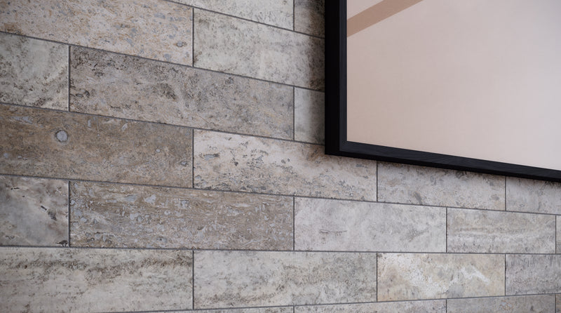 Anatolia Silver Ash filled & honed travertine tile in a room setting — available at Surface Group lifestyle image