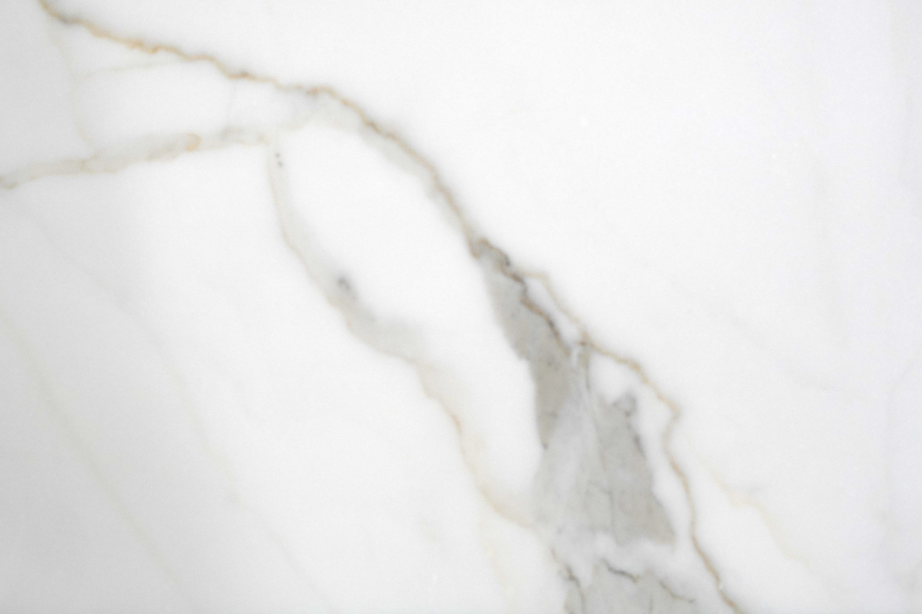 Calacatta Gold Calacatta Gold / Statuario marble trim, top-down product view, 3"×12" size. Premium marble for floors and walls.