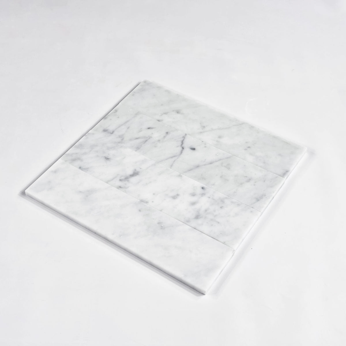 Elon Tile Bianco Carrara Field Tile tile arrangement — available at Surface Group