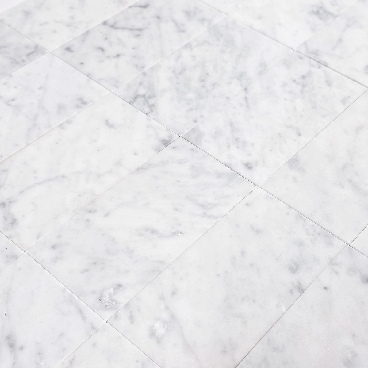 Elon Tile Bianco Carrara Field Tile tile arrangement — available at Surface Group