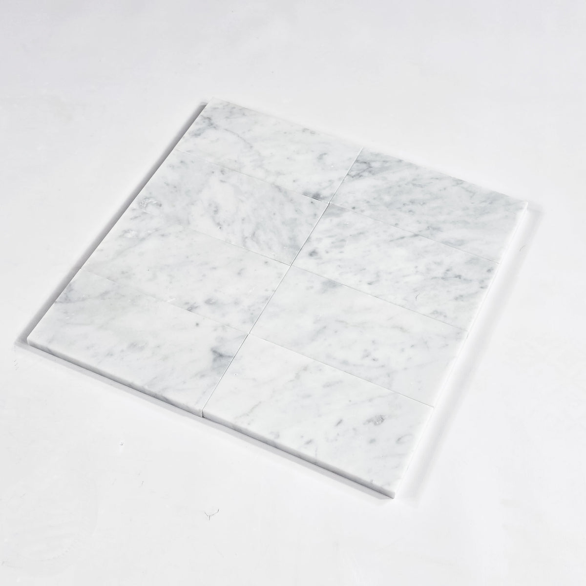 Elon Tile Bianco Carrara Field Tile tile arrangement — available at Surface Group