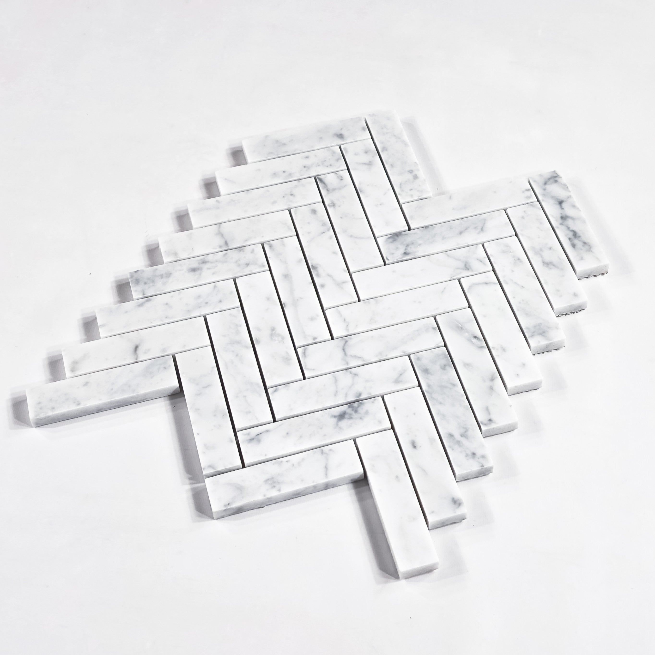 Elon Tile Herringbone tile close-up view — available at Surface Group
