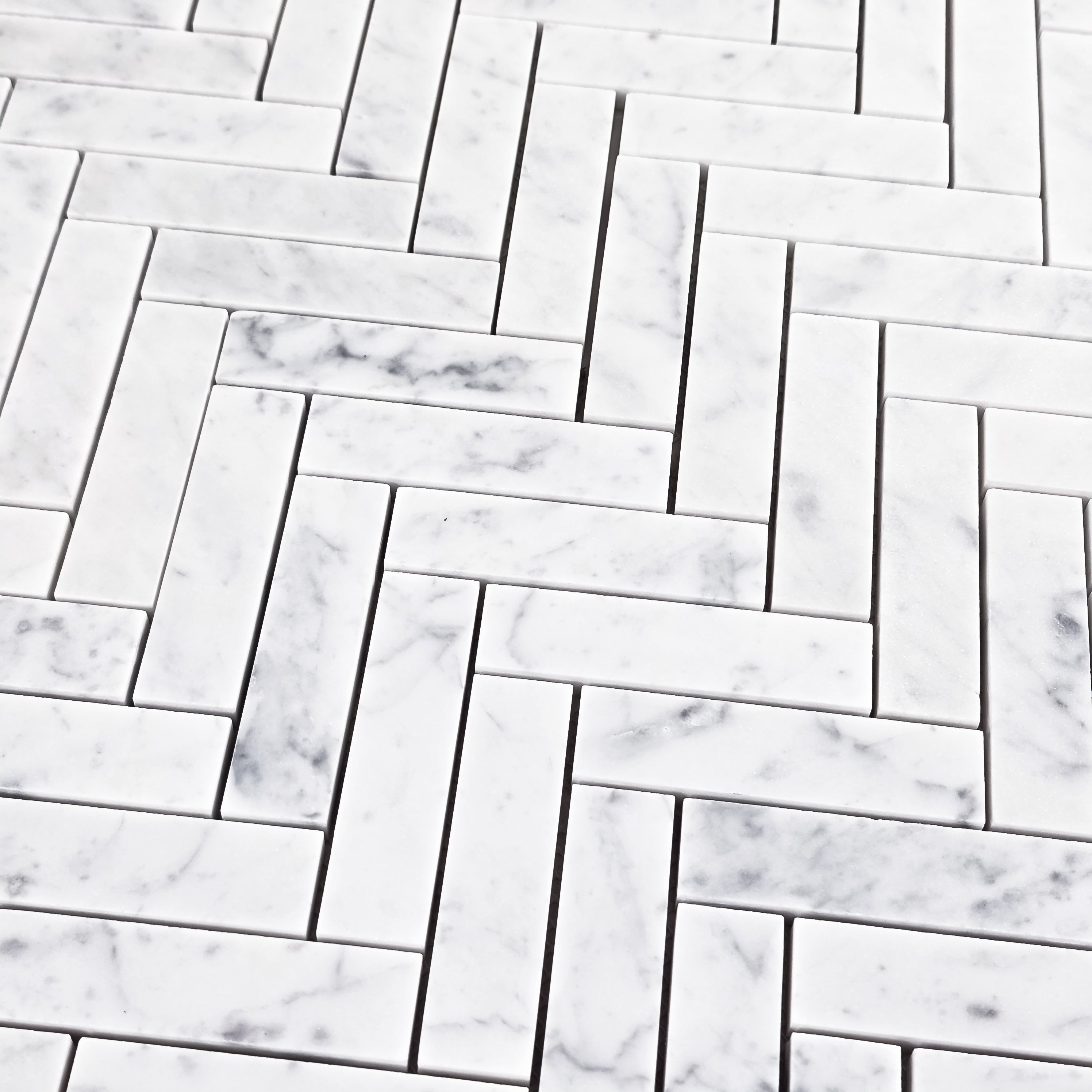 Elon Tile Herringbone tile arrangement — available at Surface Group