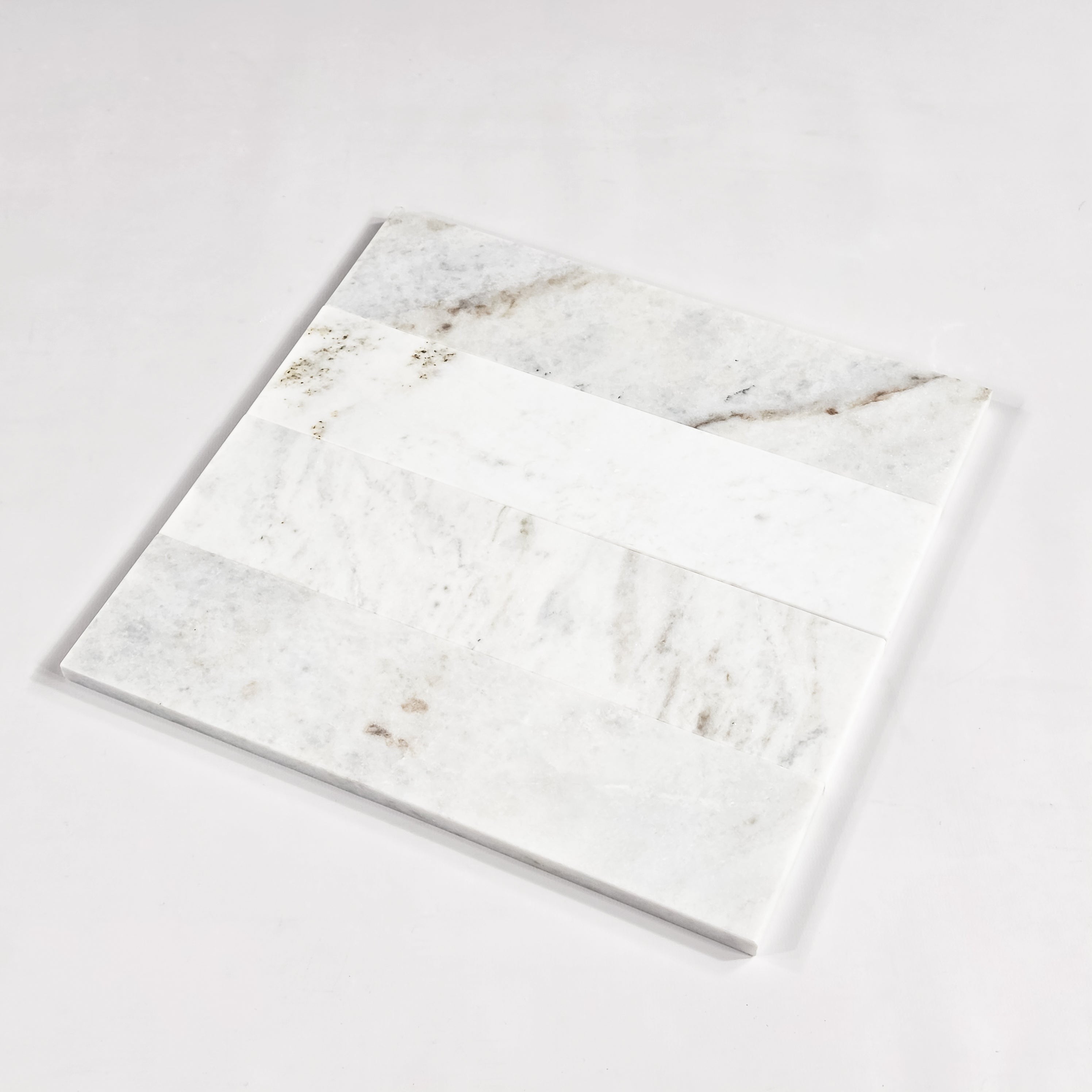 Elon Tile Bianco Oro Field Tile tile arrangement — available at Surface Group