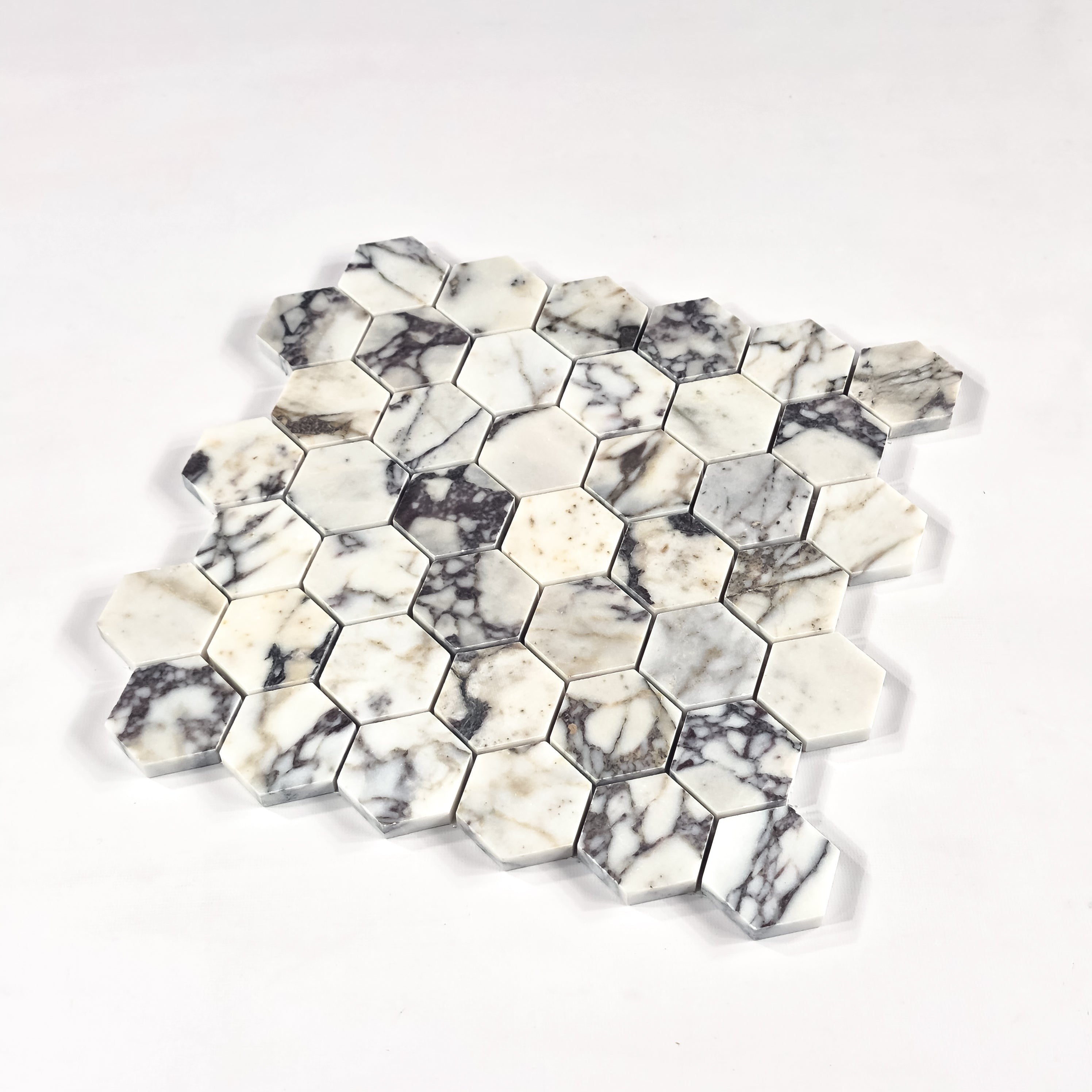 Elon Tile Hexagon tile close-up view — available at Surface Group