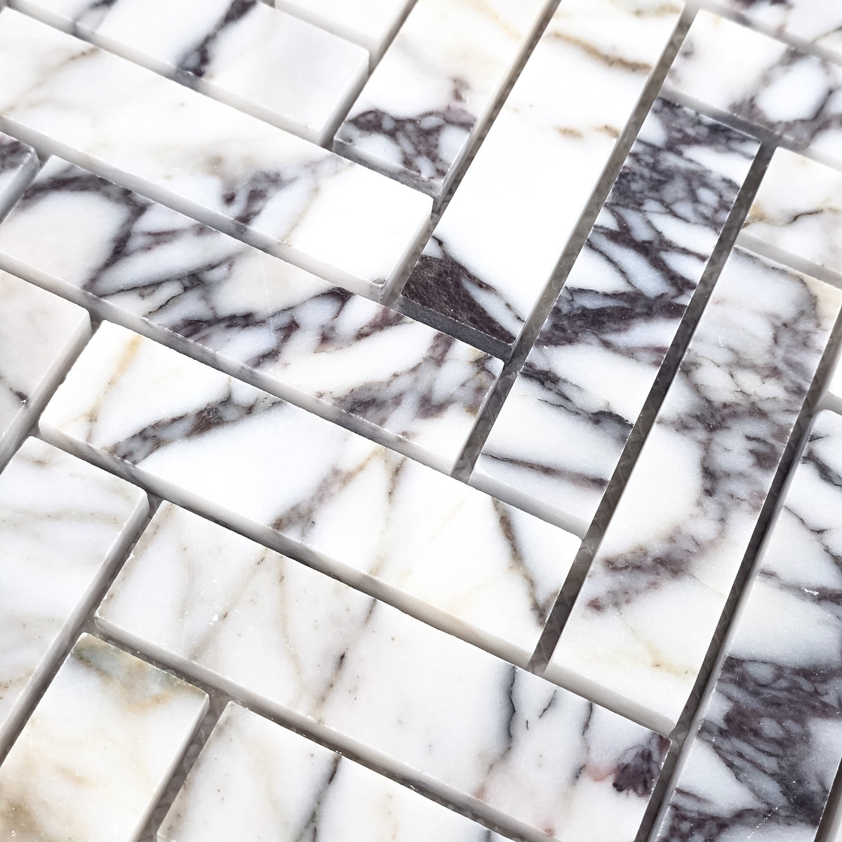 Elon Tile Herringbone tile arrangement — available at Surface Group