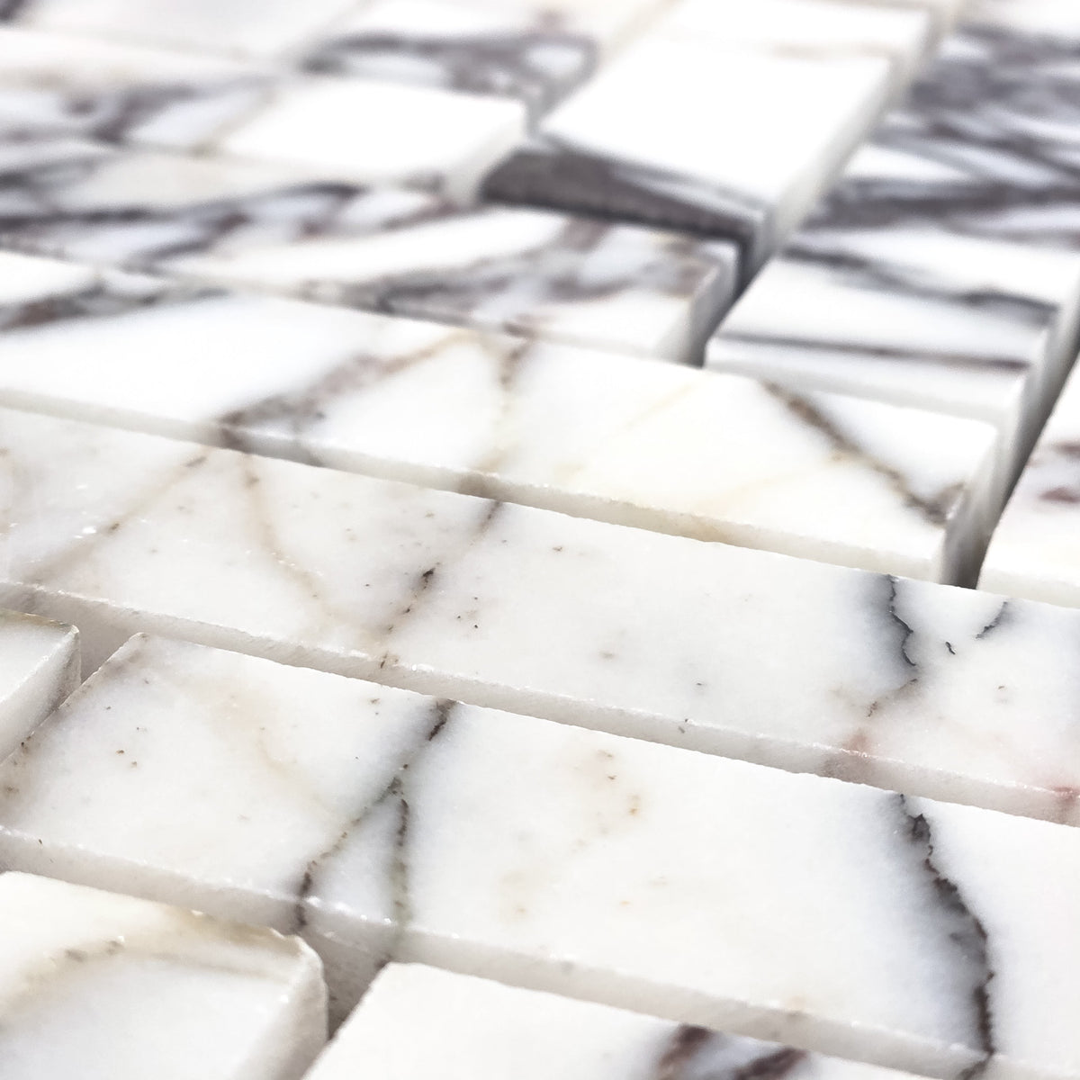 Elon Tile Herringbone tile arrangement — available at Surface Group