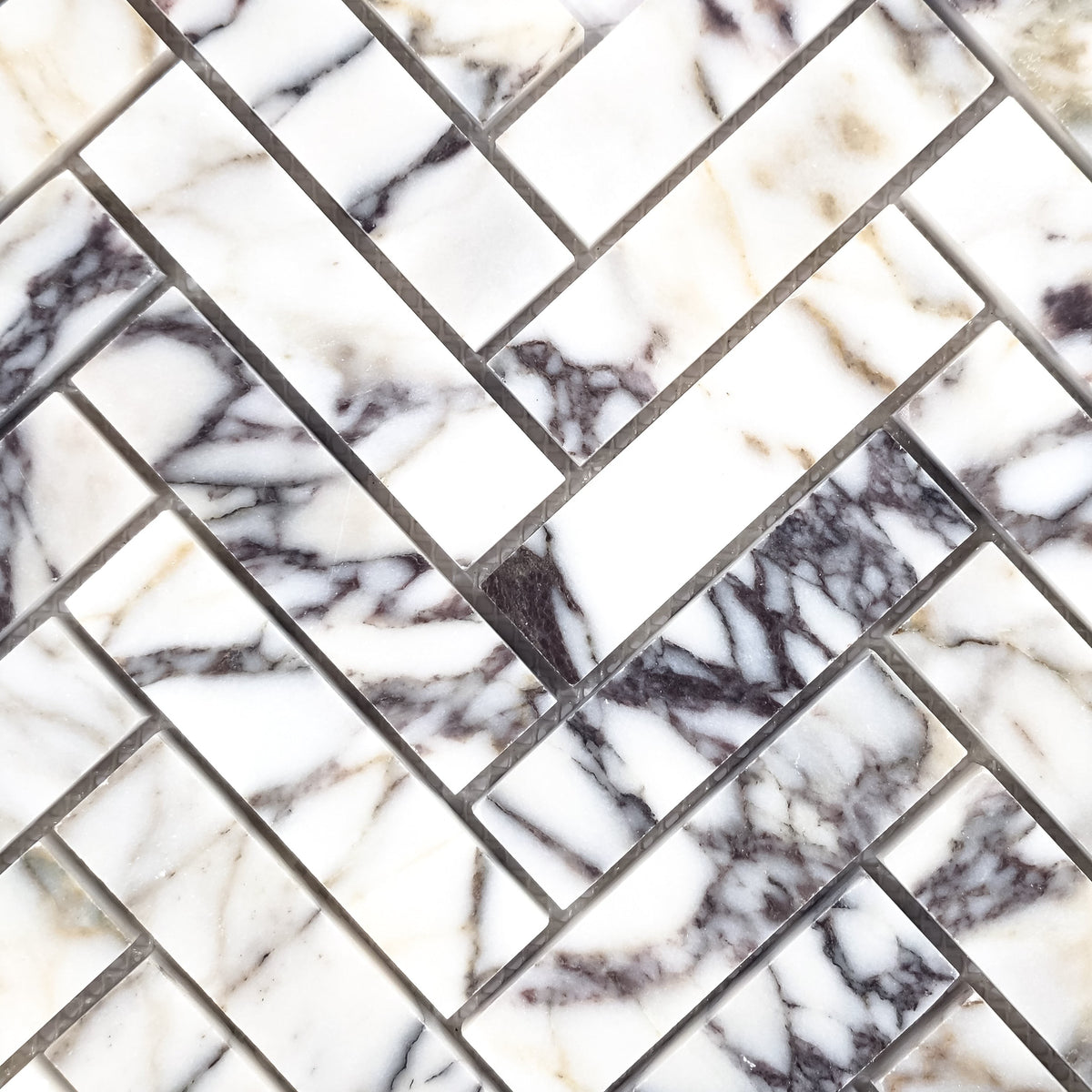Elon Tile Herringbone tile pattern swatch — available at Surface Group