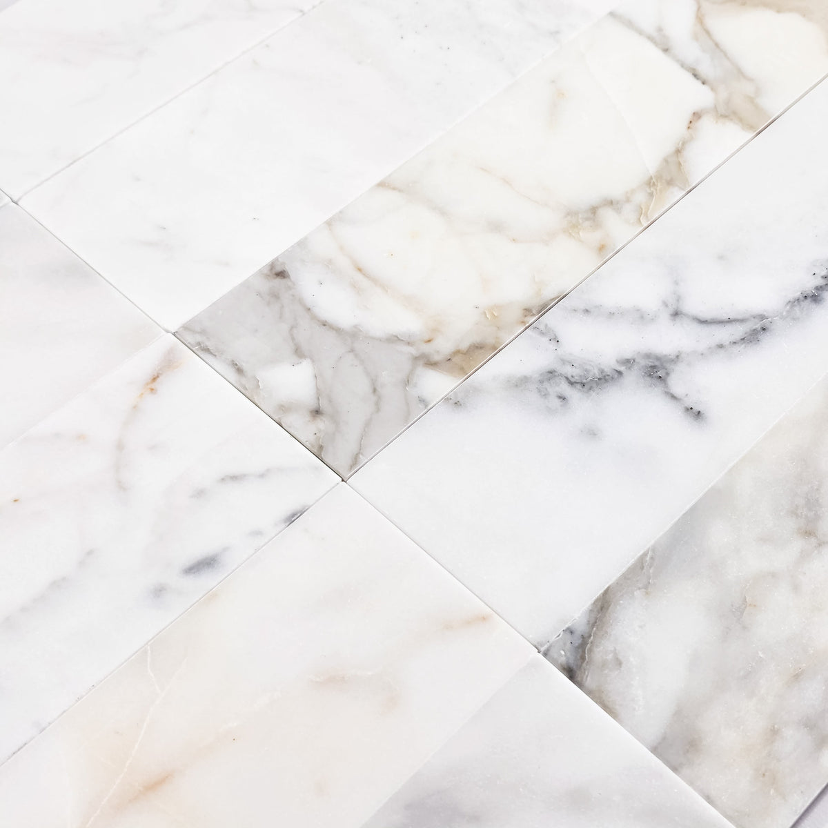 Elon Tile Calacatta Gold Field Tile tile arrangement — available at Surface Group