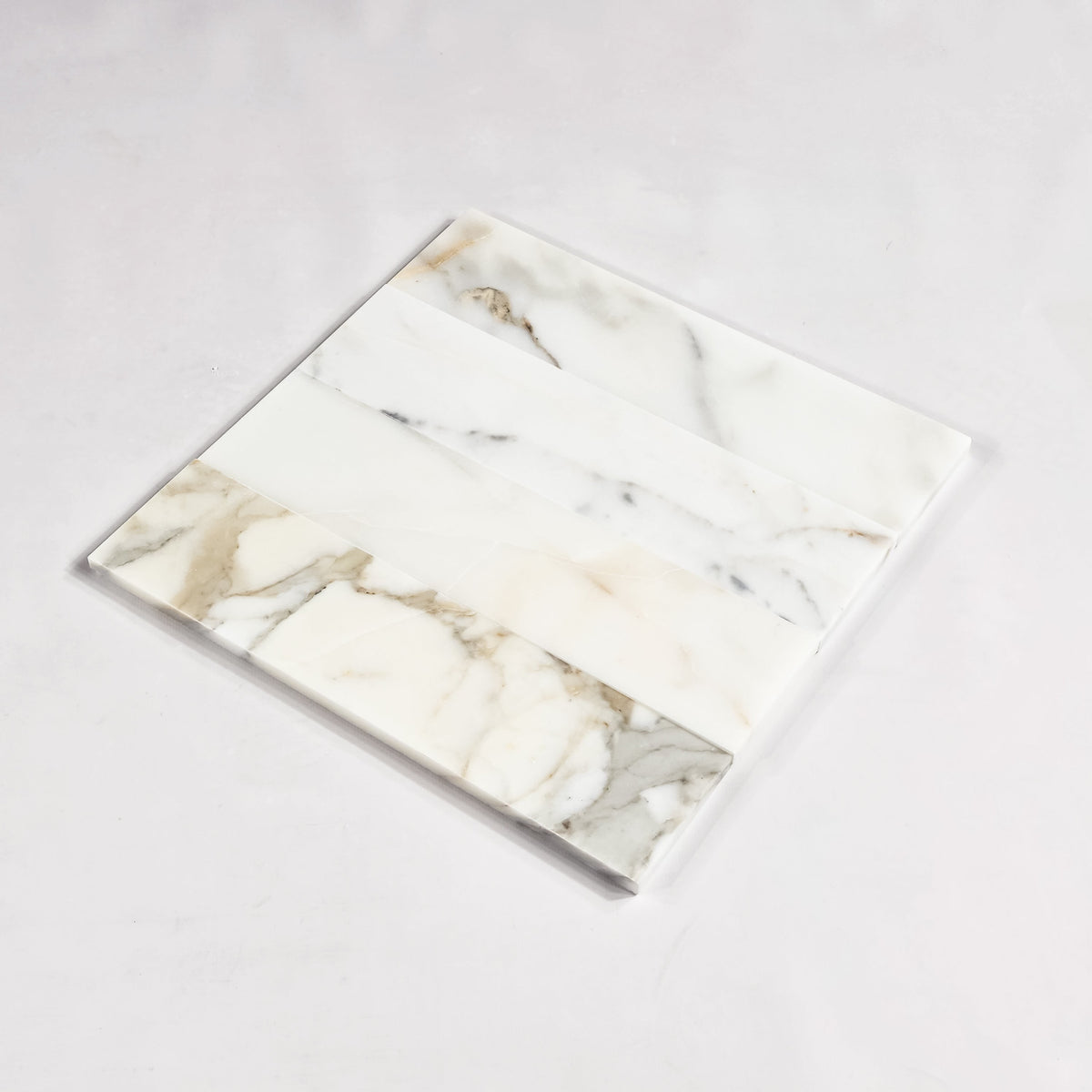 Elon Tile Calacatta Gold Field Tile tile arrangement — available at Surface Group