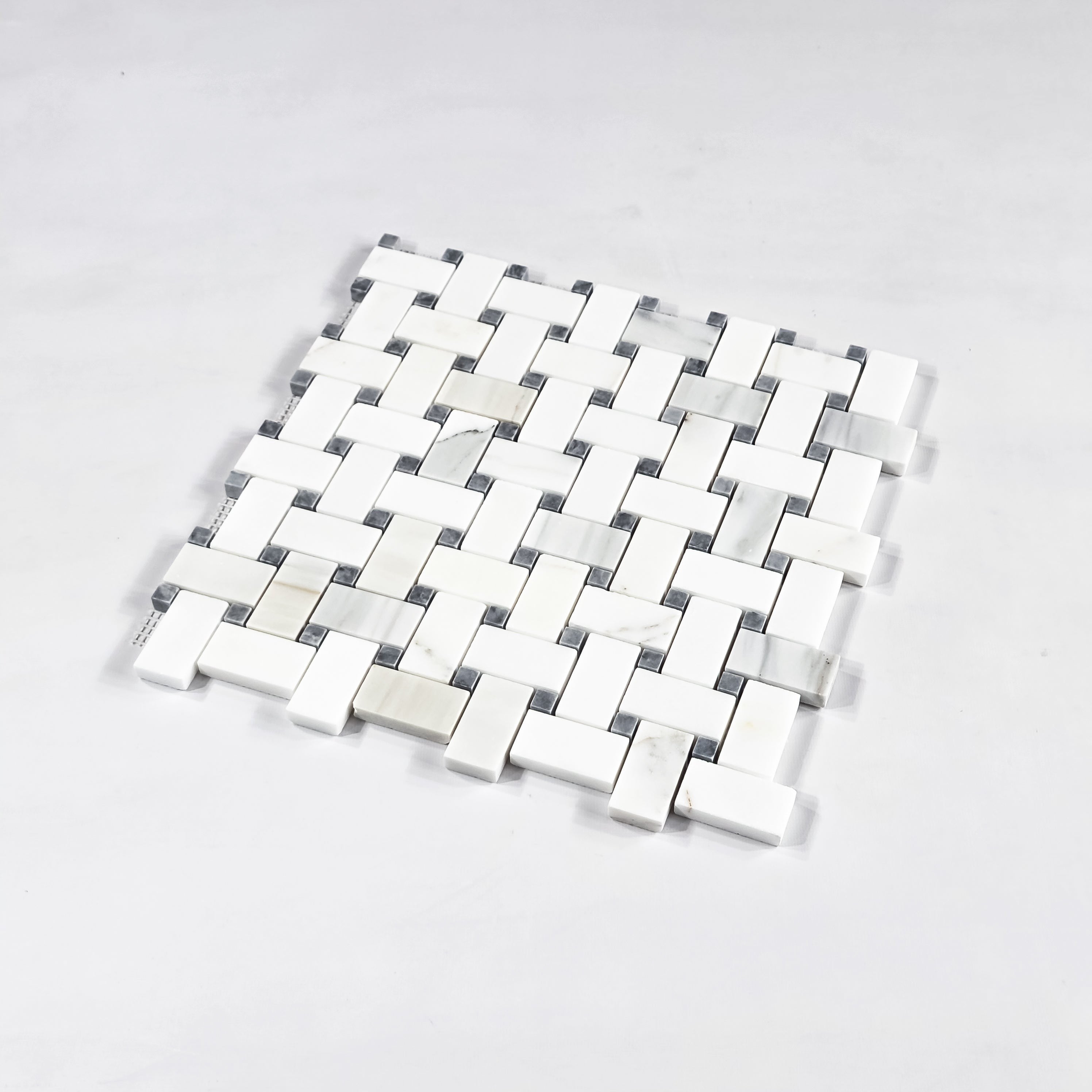 Elon Tile Herringbone tile close-up view — available at Surface Group