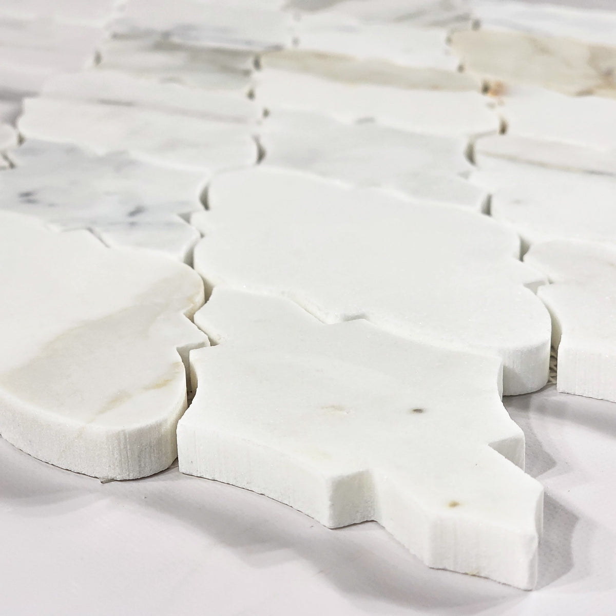 Elon Tile Calacatta Gold Mosaic tile arrangement — available at Surface Group