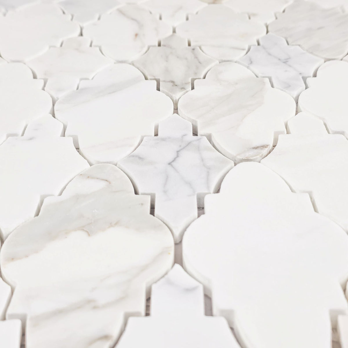 Elon Tile Calacatta Gold Mosaic tile arrangement — available at Surface Group