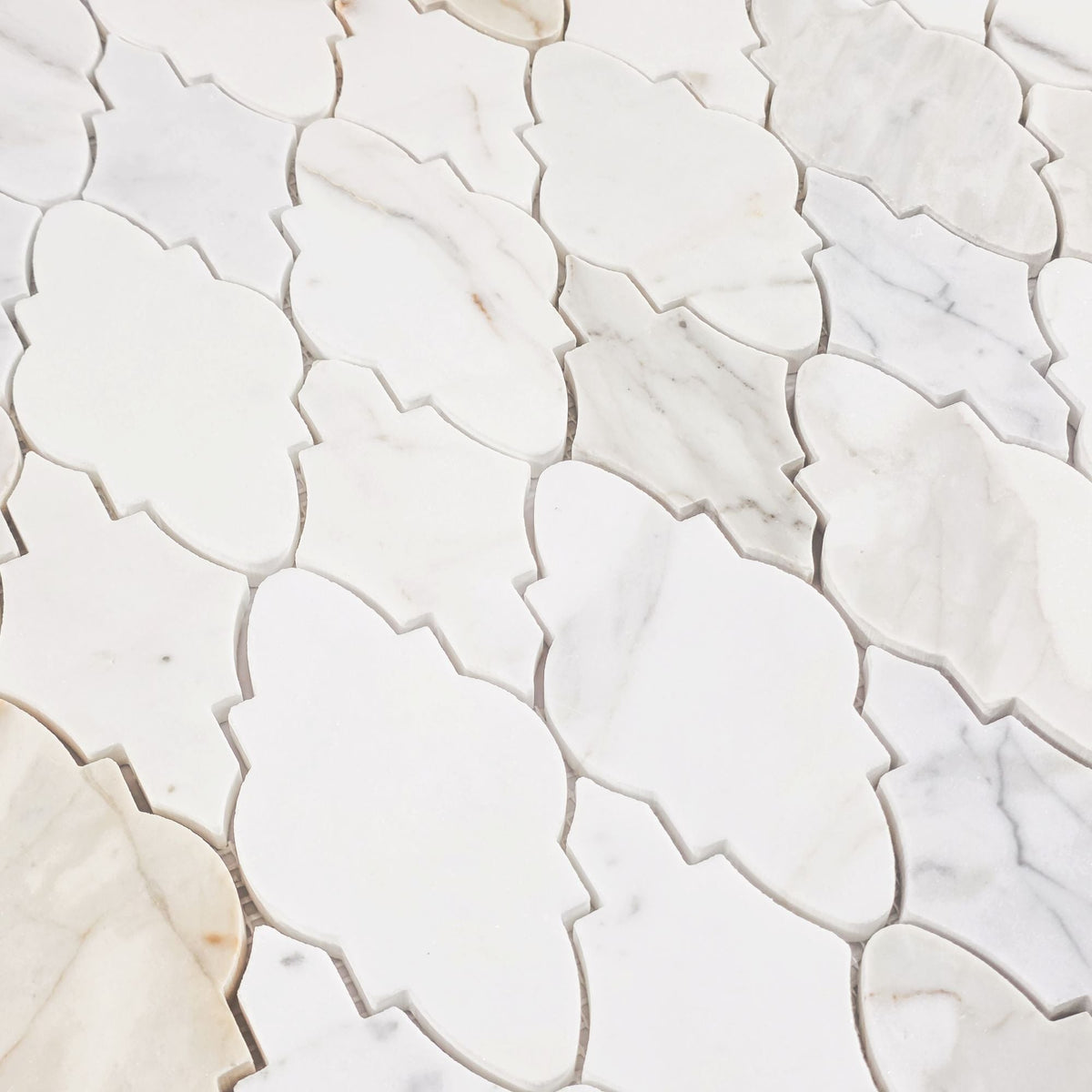 Elon Tile Calacatta Gold Mosaic tile arrangement — available at Surface Group