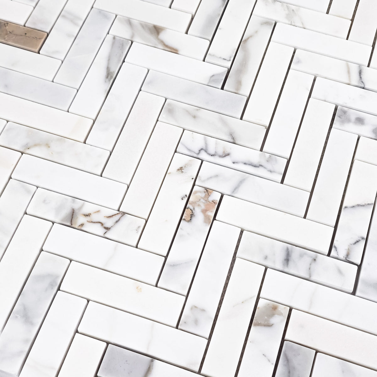 Elon Tile Herringbone tile arrangement — available at Surface Group