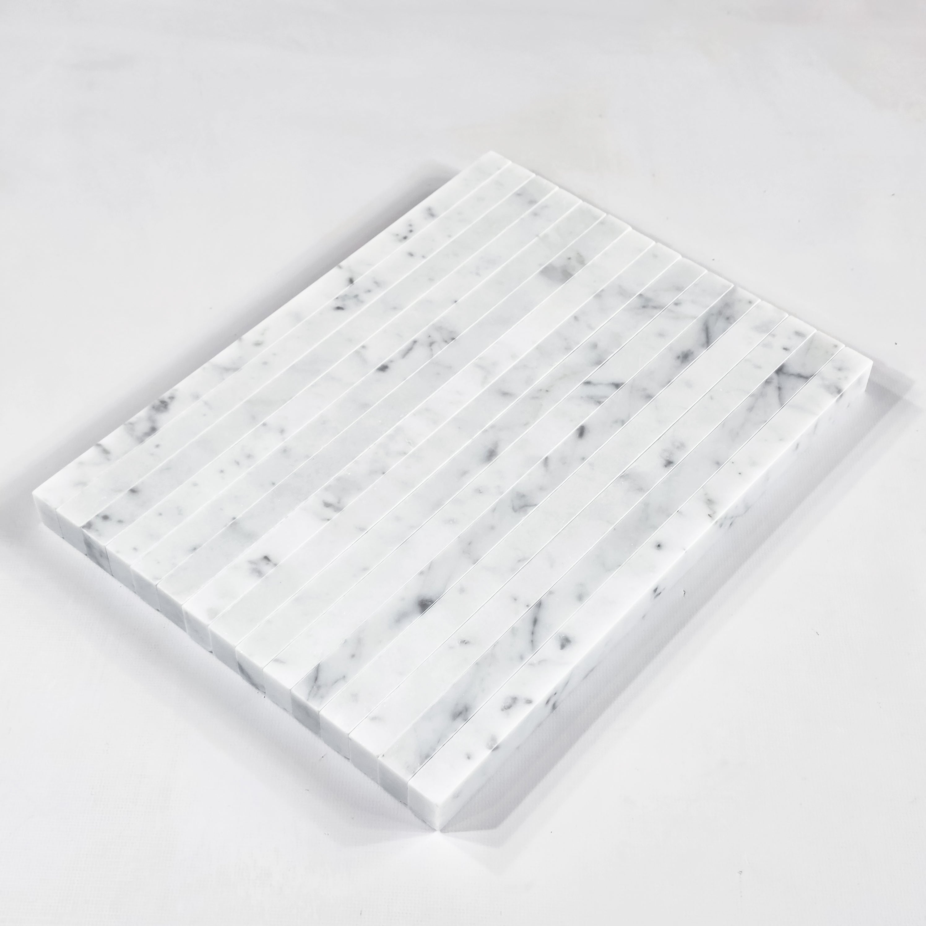 Elon Tile Flat Liner tile arrangement — available at Surface Group