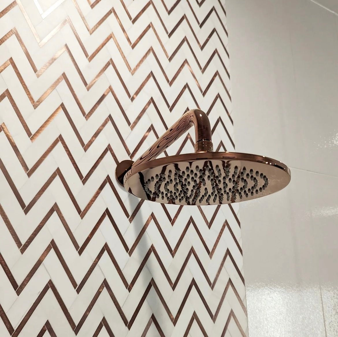 Elon Tile Herringbone tile in a room setting — available at Surface Group