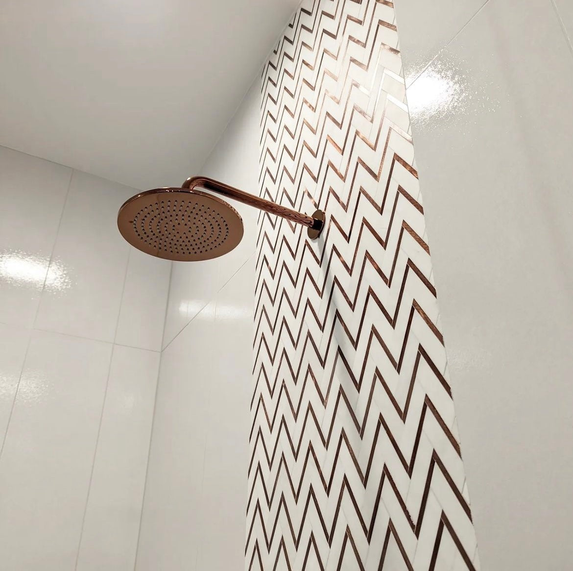 Elon Tile Herringbone tile in a room setting — available at Surface Group