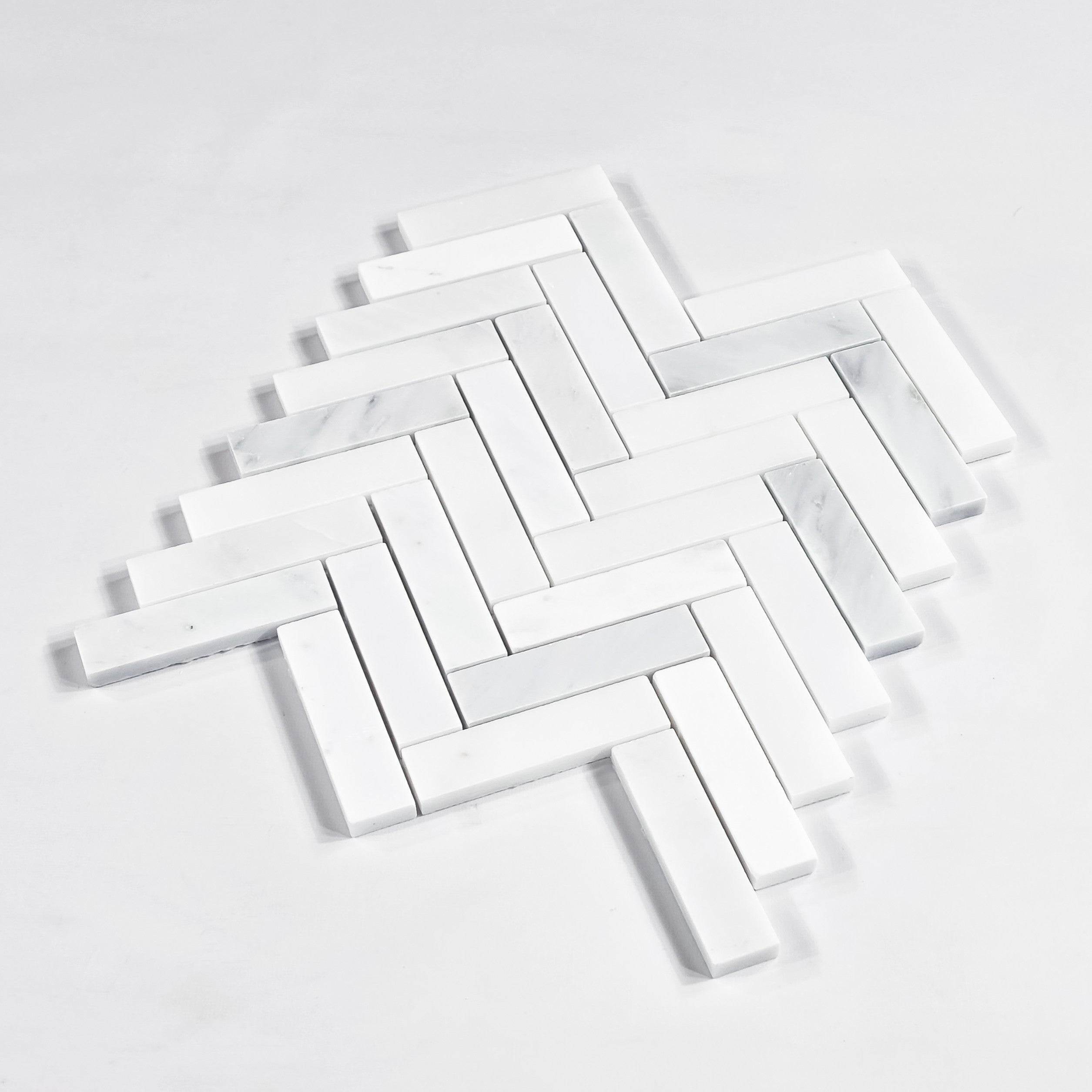 Elon Tile Herringbone tile close-up view — available at Surface Group