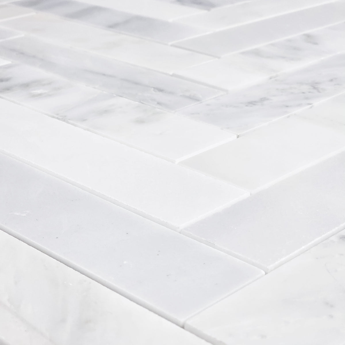 Elon Tile Herringbone tile arrangement — available at Surface Group