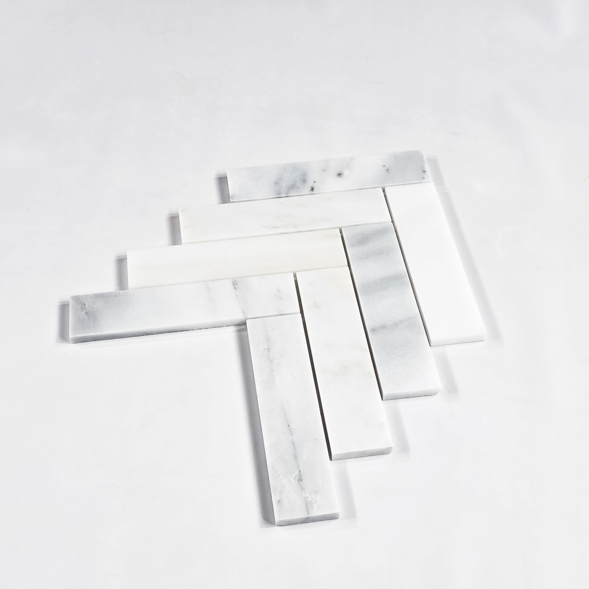 Elon Tile Herringbone tile arrangement — available at Surface Group