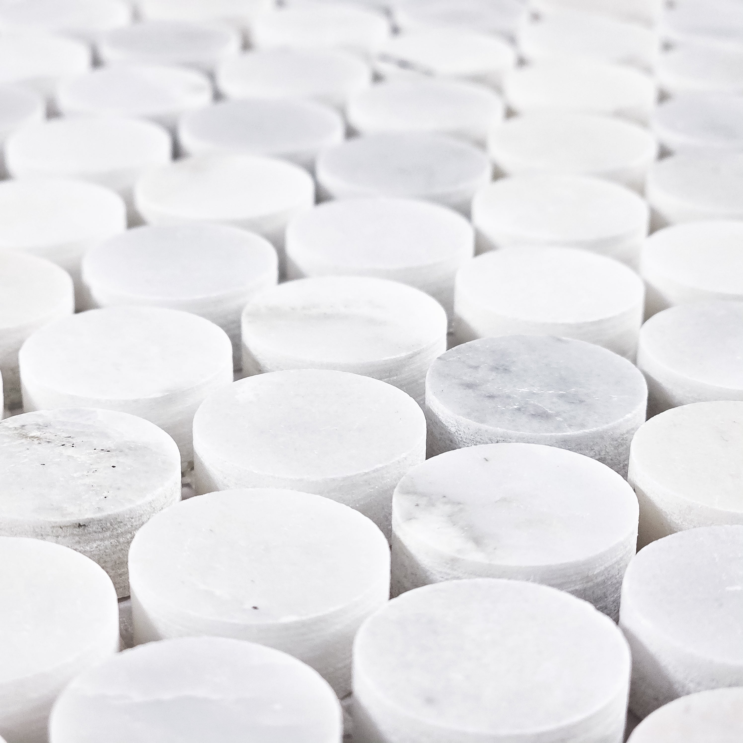 Elon Tile Rounds tile arrangement — available at Surface Group