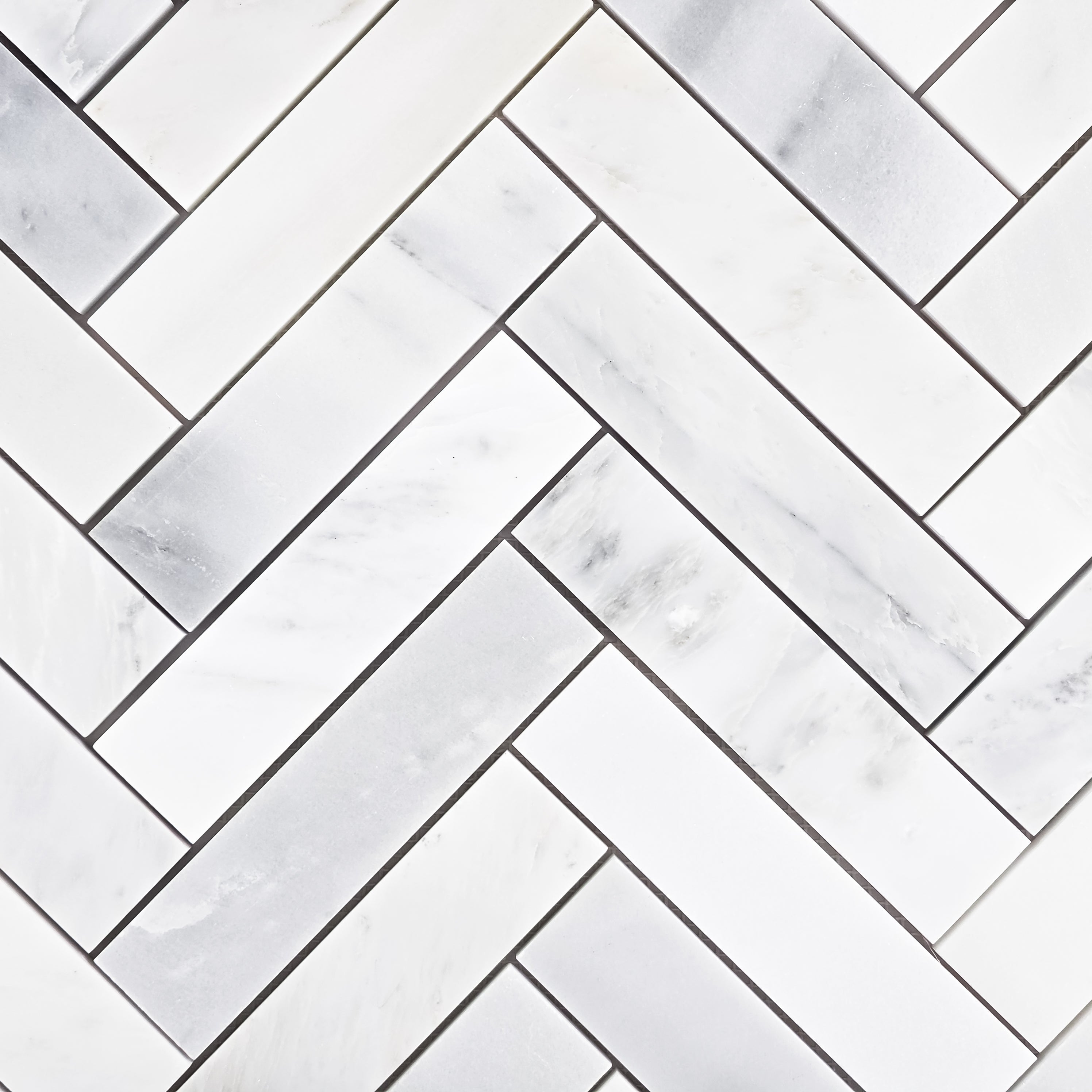 Elon Tile Herringbone tile pattern swatch — available at Surface Group