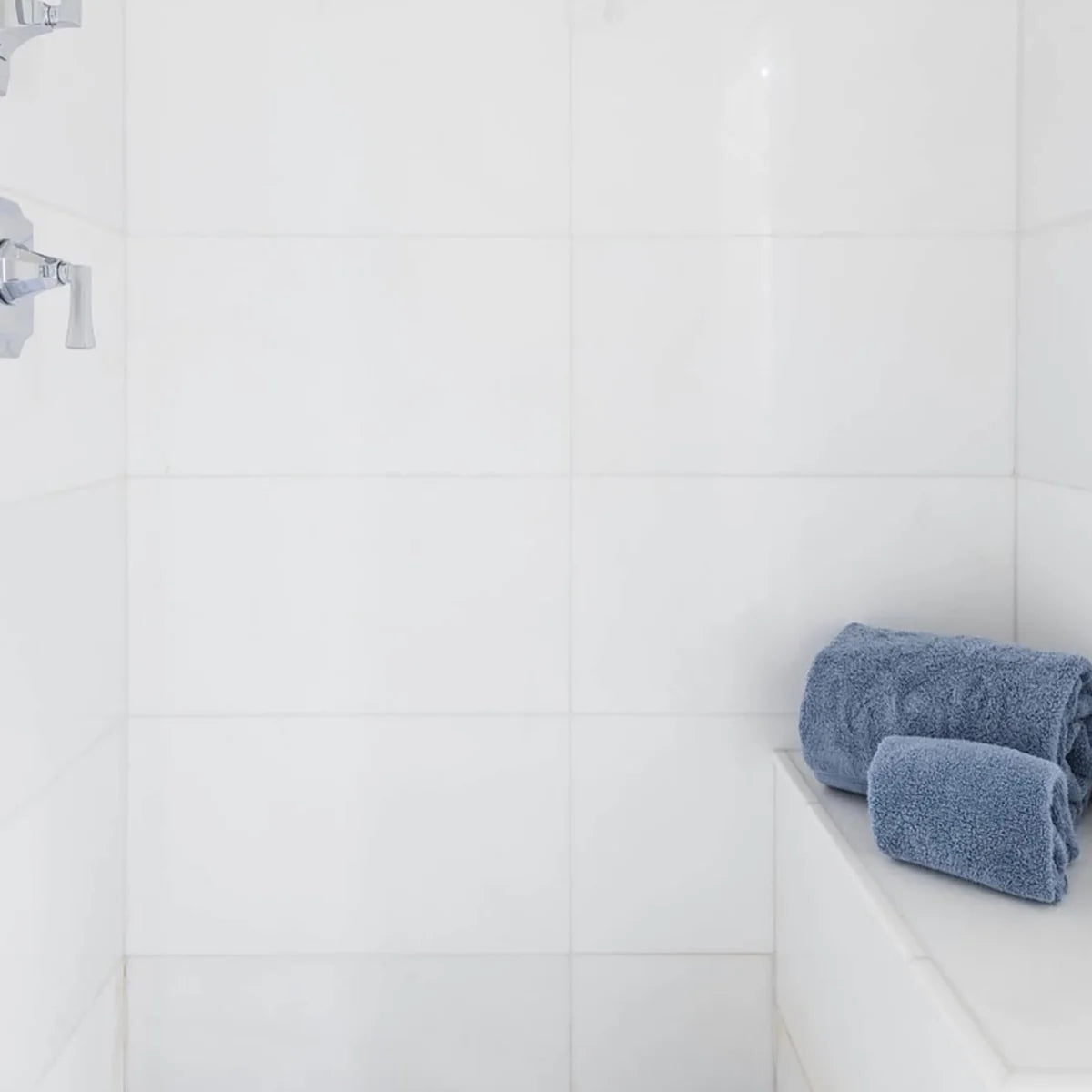 Essentials Natural Stone White field tile, lifestyle installation view 1. Premium marble for floors and walls.