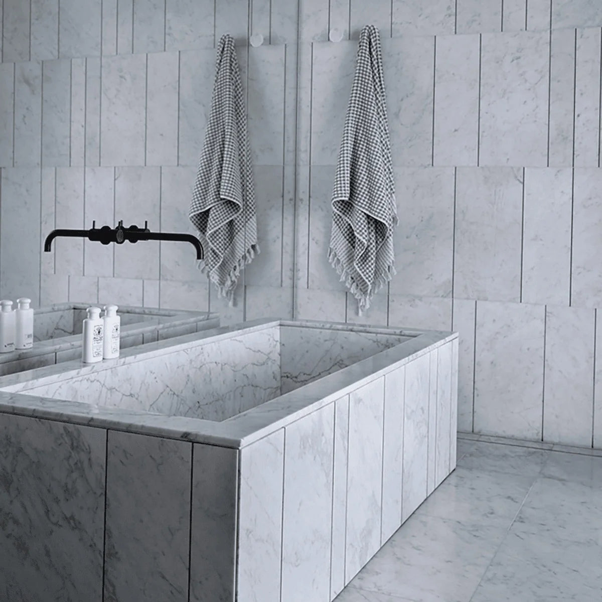 Essentials Natural Stone White field tile, lifestyle installation view. Premium marble for floors and walls.